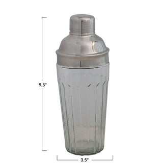 Glass cocktail shaker with stainless steel top; clear ribbed glass body.