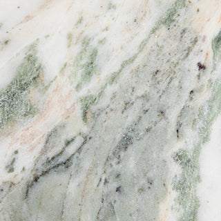 Marble cheese and cutting board pattern with green and pink veins on white background