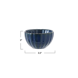 Stoneware ribbed bowl with reactive blue glaze, 2 in tall, 3.5 in diameter.