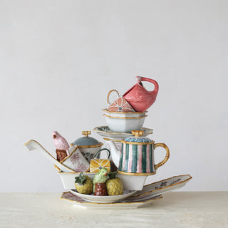 Flamingo-shaped mug, hand-painted stoneware in pink, white and brown, 14 oz, shown with colorful ceramic dishes