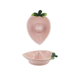 Hand-painted pink strawberry-shaped stoneware juicer with green leaves