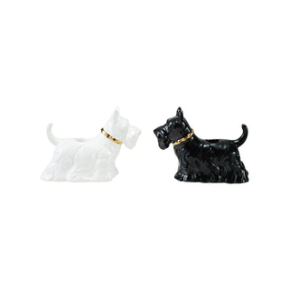 Pair of ceramic Scottie dog taper candle holders in white and black with gold electroplated collars