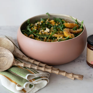 9 oz. Peach Jam jar beside a pink bowl of salad with arugula, corn and peach slices