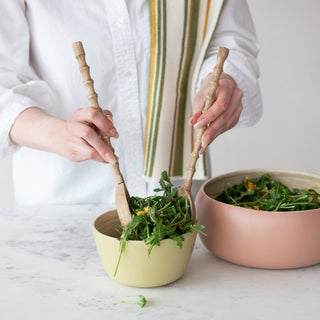 9 oz. Peach Jam Jams + Jellies: person tossing arugula in pastel green and pink bowls.