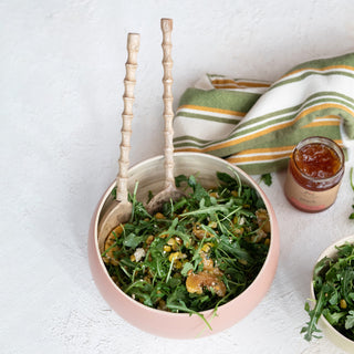 Peach jam jar, 9 oz, beside a pink bowl with arugula salad and wooden spoons.