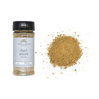 That's Amore Topper seasoning bottle, 3.3 oz, with spilled golden-brown spices