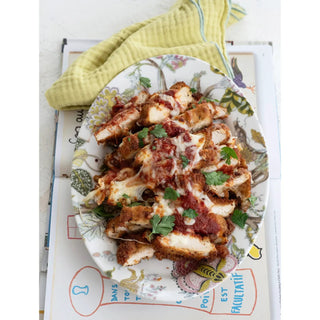That's Amore Topper Seasoning plate of crispy chicken parmesan bites with marinara, melted cheese, and parsley