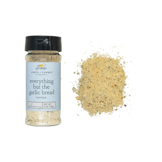 Everything but the garlic bread Topper seasoning bottle with a light blue label and beige herb blend.
