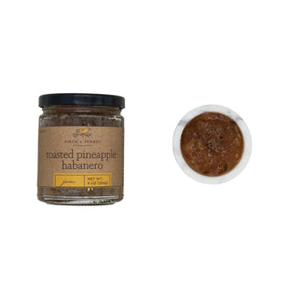 Roasted pineapple habanero jam in a 9 oz glass jar with a brown kraft label