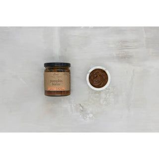 Pumpkin butter jam jar, 9 oz, glass with brown kraft label beside a small bowl of jam