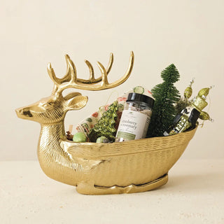 Cranberry + rosemary spice brine jar, 13 oz, in a gold decorative reindeer-shaped basket with holiday decor.