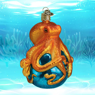 Octopus ornament with glittering orange top and teal-blue glittery base on a glass ball.