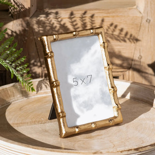 Gold bamboo-style photo frame with textured metallic gold finish and slim profile.