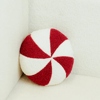 Peppermint Round Pillow in red and white soft plush fabric.