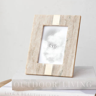 Rectangular photo frame in beige marble finish with a brass strip, holds 4x6 photos.