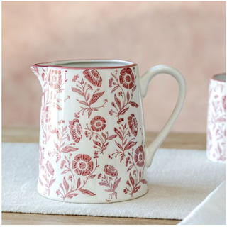 Red primrose pattern ceramic pitcher with floral motifs