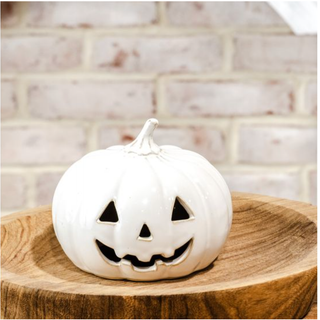 White ceramic jack-o’-lantern, 4.5-in wide, with a carved face on a wooden display pedestal