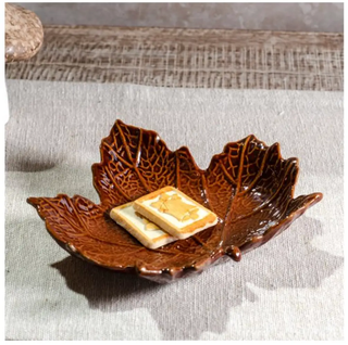 Leaf-shaped burnt-brown ceramic plate with detailed vein pattern