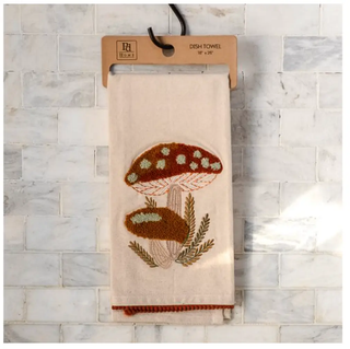 Mushroom dish towel, beige cotton with orange-brown embroidered mushroom design.