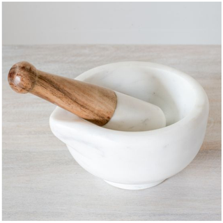 White marble mortar and pestle set with wooden pestle for grinding spices