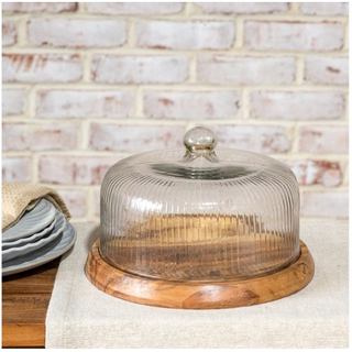 Wood base with a striped ribbed glass dome on a round wooden platform