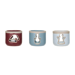 Stoneware tealight holders set of 3 in red, blue, and white with beige rims and cut-out silhouettes