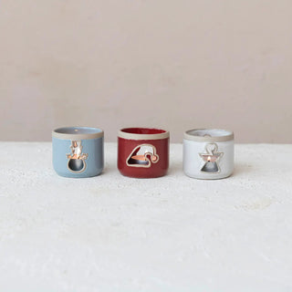 Stoneware tealight holder with cut-out silhouettes in blue, red and white (set of 3)