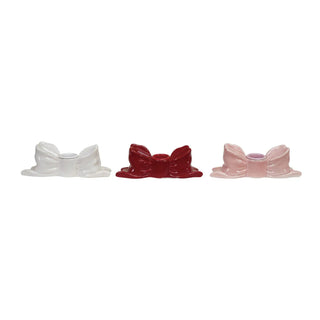 Stoneware bow-shaped taper candle holders, set of 3 in white, red and pink