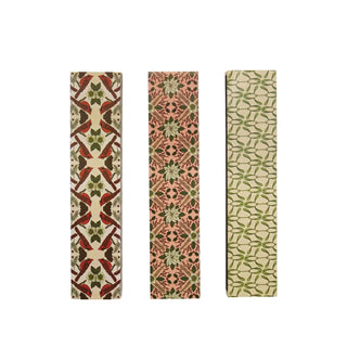 Matchbox-style safety fireplace matches in three botanical-pattern boxes, featuring red, pink, and green plant designs.