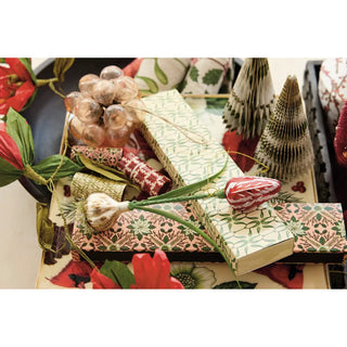 Safety fireplace matches in a matchbox with seasonal botanical pattern; green and pink floral packaging