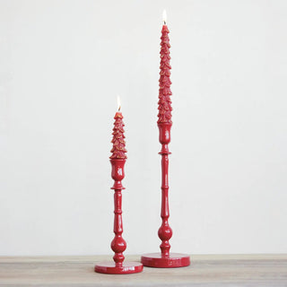 Taper candle holders set: two red enameled cast-aluminum pieces on a wooden surface.