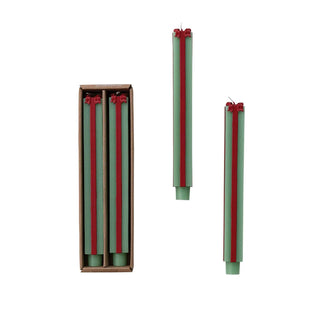 Taper candles in green and red, unscented package-shaped set; box contains three with two more shown outside.