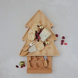 Bamboo tree-shaped cheese serving board with sliding knife inset and crackers