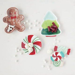 Hand-painted ceramic candy-striped plate; round dinnerware in red and white with green accents.