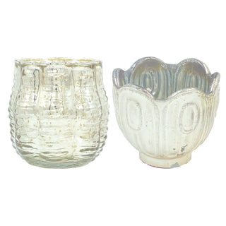 Two embossed mercury-glass candleholders: scalloped silver-finish tealight holder and textured clear votive.