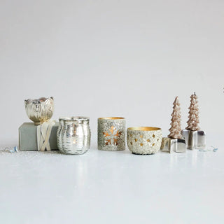 Embossed mercury glass scalloped tealight/votive holder in silver finish, shown among metallic candleholders.