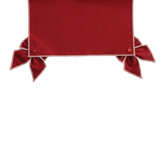 Table runner in red cotton and linen with pink stitched edge and two detachable bows.