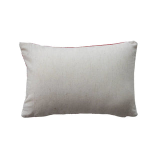 Cotton lumbar pillow in beige with red piping trim.