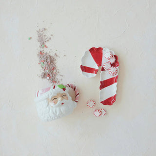 Stoneware candy cane-shaped dish in red and white stripes with scalloped edges