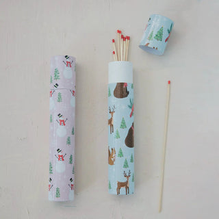 Safety fireplace matches in three holiday-patterned tubes; lavender and sky-blue wraps with several matches visible.