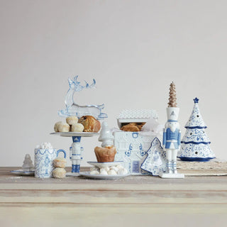 Nutcracker-shaped ceramic taper holder with silver electroplating in white and blue