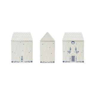 Ceramic house-shaped cookie jar set in white and blue with stars, wreath, and textured roofs; three pieces.