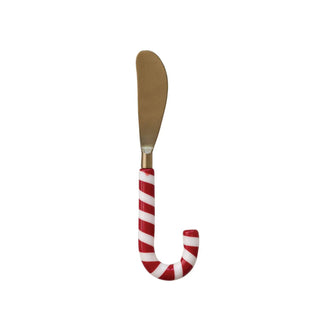 Stainless steel spreader with candy cane-shaped red-and-white resin handle.