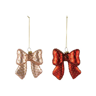 Two hand-painted glass bow ornaments with diamond-pattern gold netting in pink and red, with gold hanging cords