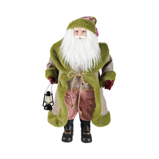 Santa figurine in beige with olive-green faux fur trim, striped red-and-beige pants, holding a lantern