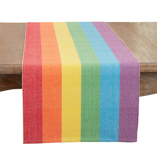 Rainbow-striped table runner on a wooden table with bold multicolor bands