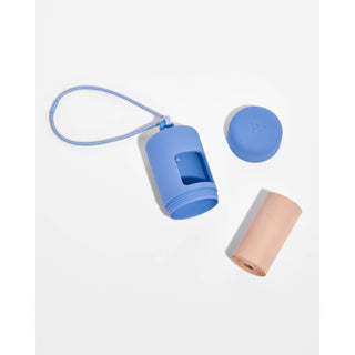 Blue poop bag dispenser with strap, cap and pink bag roll — 3-piece set