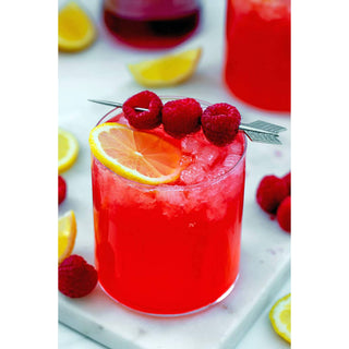 Very Berry Raspberry Wine Slushy Mix cocktail in a red glass with orange slice and raspberry garnish.