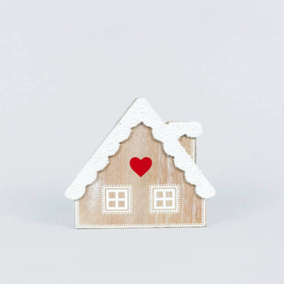 Chunky wooden cabin Christmas decor with snow-dusted roof and red heart on front.