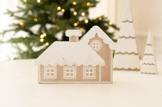 7x5 chunky tan wooden house ornament with snowy white roof.